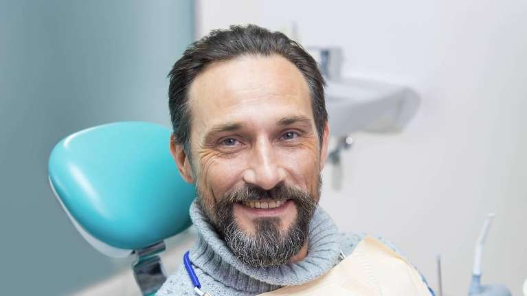 man sitting in a dental chair