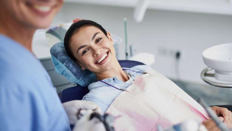 woman sitting in a dental chair