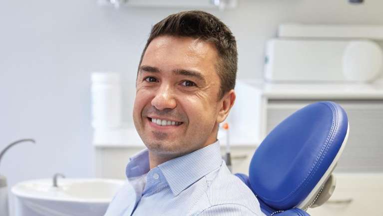 Man sitting in a dental chair