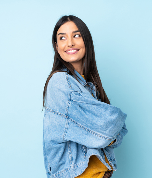 Wilmette Dental Institute | Happy woman looking back over her shoulder